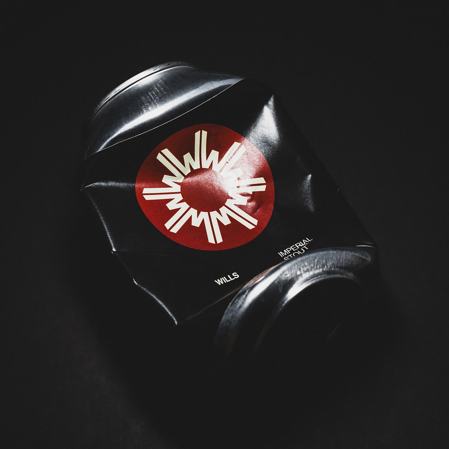 Crushed can of WILLS Brewery's imperial stout, set against a high-contrast black backdrop