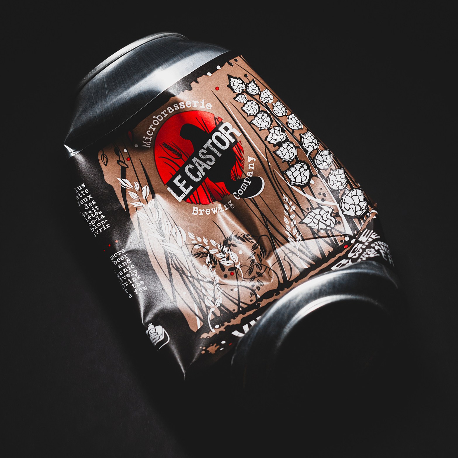 Crushed can of Le Castor's American Barleywine, set against a high-contrast black backdrop.